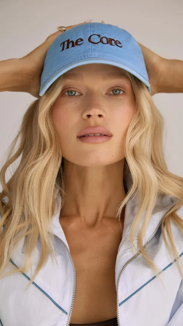 Vita Sidorkina wearing a light blue The Core cap